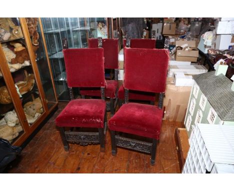 A set of four late 19th Century Italian carved and stained wood dining chairs in 17th Century style, the burgundy velvet padd