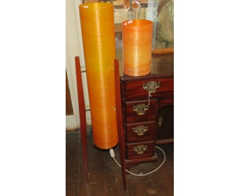 A 1960's teak floor standing tripod rocket lamp with orange spun fibreglass shade, 130cm high and a spun fibreglass shade fro