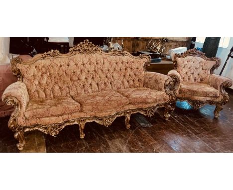 A Louis XIV revival oak sofa, serpentine shape with scrolling foliage carving throughout, button back, scrolling arm rests, r