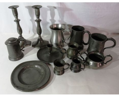 A collection of 19th and 20th C pewter, to include a pair of candlesticks, chamber stick, tankards and other items