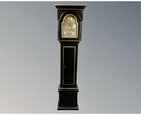 A 20th century continental black and gilt longcase clock with brass and silvered dial signed F. L. Baamand, no pendulum or we