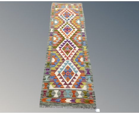 A Chobi kilim runner, 188cm by 62cm