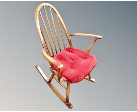 An Ercol elm and beech rocking chair in an antique finish.