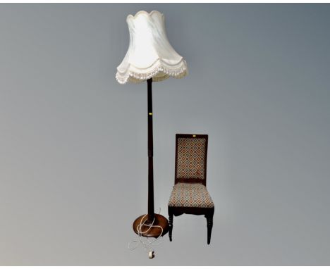 An Edwardian bedroom chair upholstered in a tapestry fabric together with a beech wood standard lamp with tasselled shade.