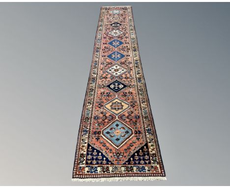 A Persian Heriz runner 85 cm x 400 cm