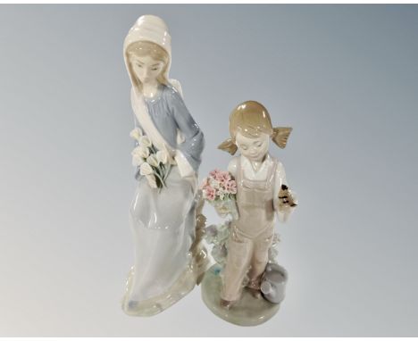 Two Lladro figures, girl with bird in hand and seated girl with lilies.