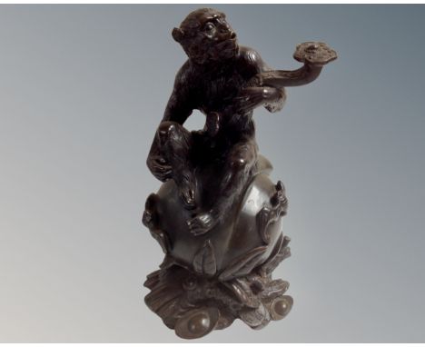 A Chinese bronze figure of a seated monkey, hight 24.5 cm 