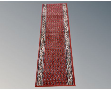 A machine made eastern design runner, 200 cm x 67 cm