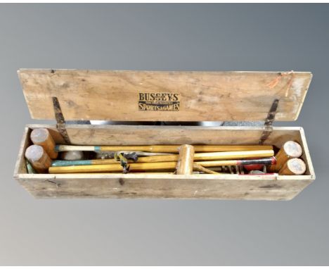 A Busseys Sports and Games croquet set in a pine box.