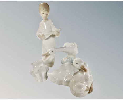 Four Lladro and Nao figures, angel with lute, polar bear cub and ducks.