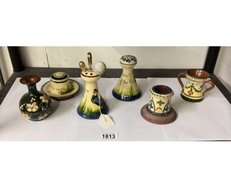 A quantity of Torquay motto ware including inkwell, hat pin holders etc.