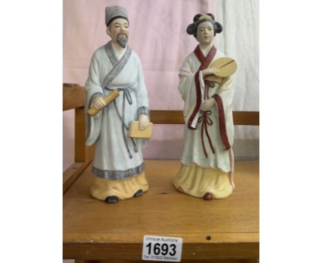 2 oriental style unglazed ceramic figures, height 26cm