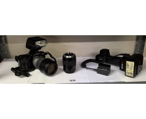 A Minolta Dynax 7000i camera with lens