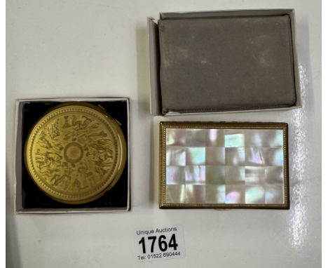A Stratton powder compact and one other.