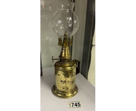 An antique French brass pigeon oil lamp