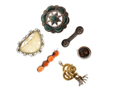 White metal pierced circular star design brooch set malachite panels, an agate set bar brooch, a jade coloured hardstone butt