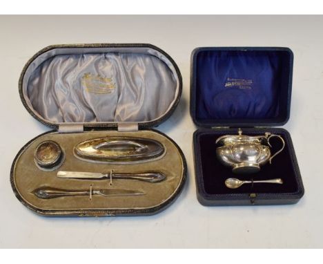 Silver mounted four piece manicure set, cased and a silver mustard and spoon with  blue glass liner, cased   Condition: 