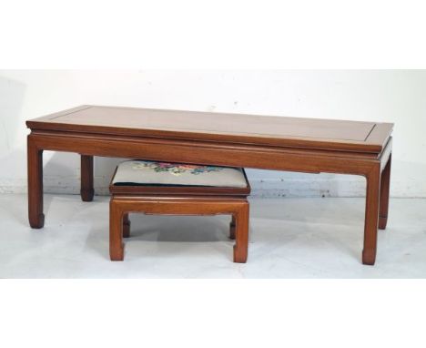 Modern Oriental hardwood rectangular top coffee table, together with a similar rectangular stool   Condition: 