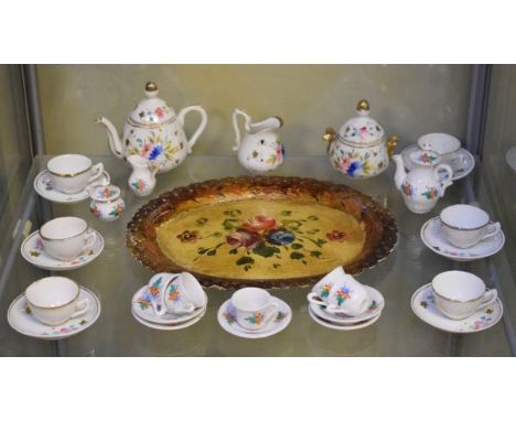 Late 19th/early 20th Century dolls tea service having painted floral decoration, together with an oval painted tole ware tray
