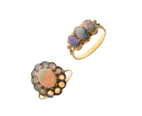 18ct gold three stone opal set dress ring and a 9ct gold opal set dress ring   Condition: 