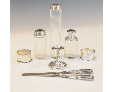 Silver dressing table candlestick, pair of George V silver handled glove stretchers, two silver napkin rings and three glass 