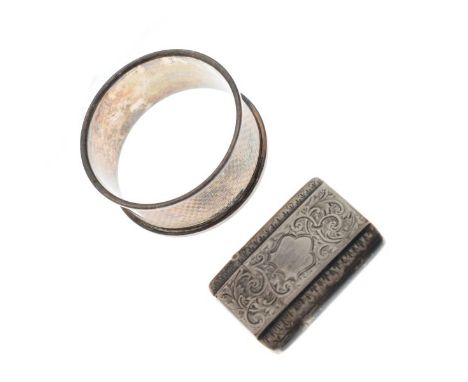 Victorian silver vesta case having allover engraved decoration, Birmingham 1893 and a silver napkin ring   Condition: 