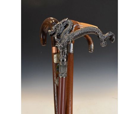 Silver mounted walking stick and three other sticks   Condition: 