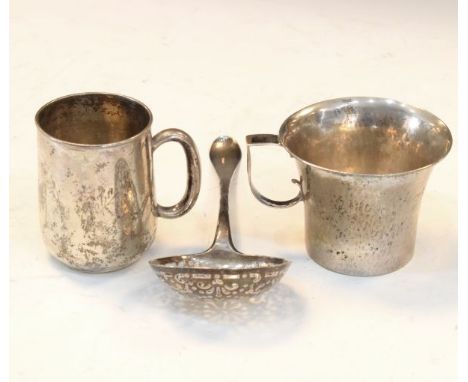 Dutch silver sifting spoon having pierced bowl together with two white metal tankards stamped 830 and 800   Condition: 