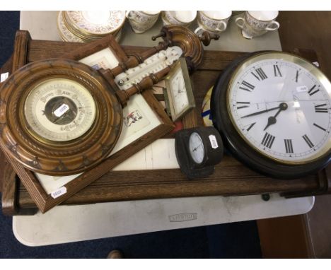 A selection of various clocks to include an oak cased clocks and barometer.
