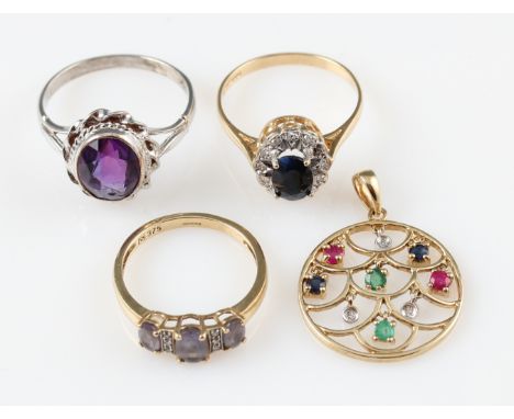 A lot to include a hallmarked 9ct yellow gold sapphire and diamond cluster ring, an amethyst ring, stamped 9ct, a hallmarked 