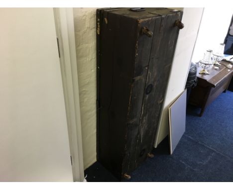 A large travel trunk painted brown.