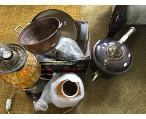 A selection of copper ware to include a kettle, together with a table lamp with yellow glass shade.