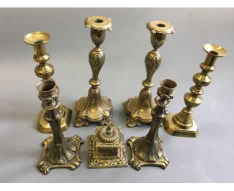 Three pairs of brass candle stick and one brass ink well.