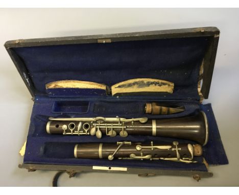 A rosewood clarinet in box.
