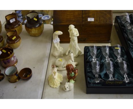 A Coalport figurine "Valentine Debutant"; together with a Beatrix Potter Beswick "Squirrel Nutkin"; three USSR animal ornamen