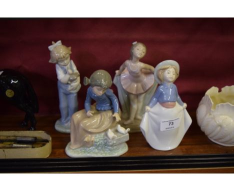 Four various Nao figurines, each in the form of children