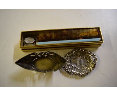 A box containing a silver bonbon dish, a silver and enamel mounted comb, a silver fork etc. 