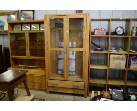 A light oak and glazed display cabinet fitted two drawers below 