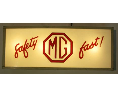 *Illuminated M.G. Sign. An electric-powered, ceiling-hanging showroom sign,  with red scripted wording, 'Safety MG Fast' agai