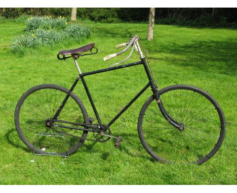 *A Leicester Cycle Co. 'No 1 Peregrine' Safety Bicycle. Painted black with a 22-inch frame with an up-turned top tube,  plung