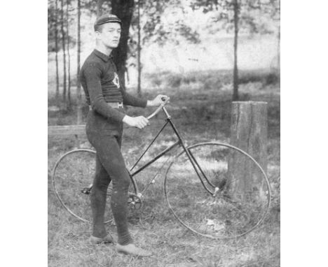 *A Cabinet Card Photograph depicting a competition cyclist holding his c1889 solid-tyred Safety Bicycle.  In excellent condit