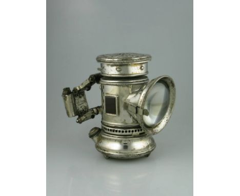 *A c1895 'Search Light' kerosene-powered bicycle lamp by the Bridgeport Brass Co. Retaining its lockable sprung bracket.  A c