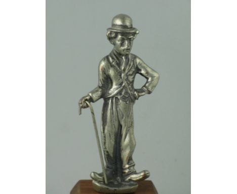 *Charlie Chaplin. A well-detailed, petit mascot,  with its original nickel-plating and walking stick, the latter often missin