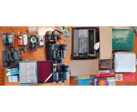 Collection of binoculars (Hanimex, Prinz, Tecnar), Kodak cameras, slide projector, carry-cabinet, accessories + 35mm slides