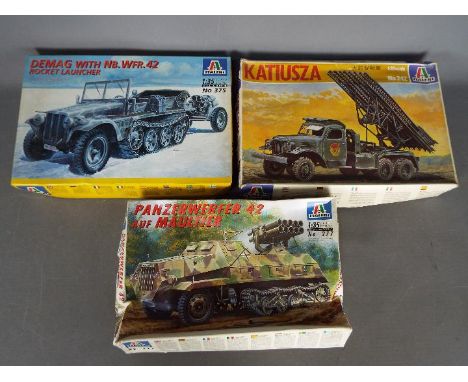 Italeri - Three boxed plastic military vehicle model kits in 1:35 scale by Italeri. Lot includes Italeri #242 Katiusza Stalin