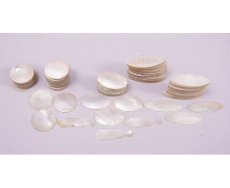 A LARGE COLLECTION OF 19TH CENTURY CHINESE ENGRAVED MOTHER OF PEARL TOKENS, of various shapes and sizes.
