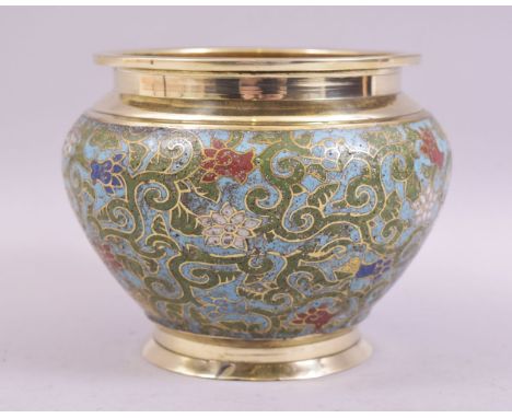 A CHINESE CHAMPLEVE ENAMEL BRASS BOWL, decorated with floral design, 15cm diameter.