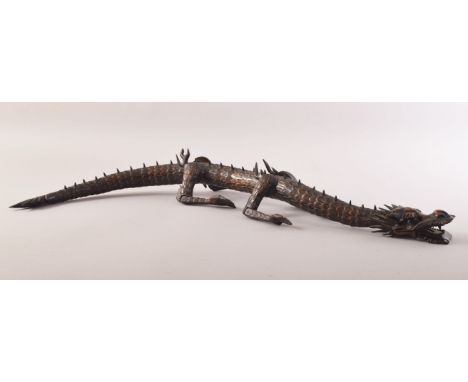A SUPERB JAPANESE BOXWOOD RETICULATED MODEL OF A DRAGON, standing on four carved legs with a reticulated body from neck to ta