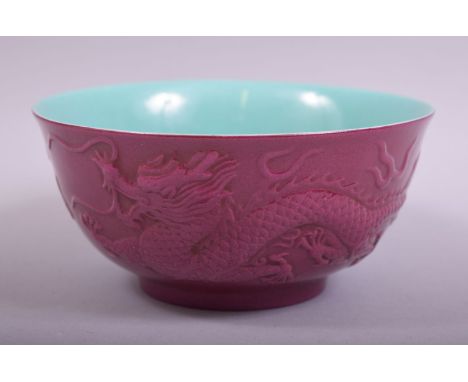 A GOOD CHINESE PINK AND TURQUOISE GLAZED PORCELAIN BOWL, the exterior with raised decoration of dragon and phoenix with the f