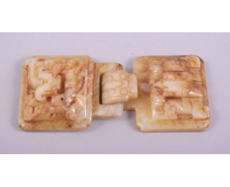 A CHINESE CARVED JADE BUCKLE, with two locking pieces (2).